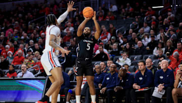 Cincinnati Bearcats guard David DeJulius shoots 3-pointer against Detroit Mercy Titans at Fifth Third Arena. USA Today.