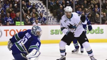 Feb 28, 2016; Vancouver, British Columbia, CAN; San Jose Sharks forward Danius Zubrus (9) shoots the puck against Vancouver Canucks goaltender Ryan Miller (30) during the second period at Rogers Arena. Mandatory Credit: Anne-Marie Sorvin-USA TODAY Sports