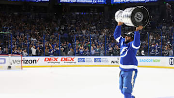 TAMPA, FLORIDA - JULY 07: Gemel Smith #46 of the Tampa Bay Lightning celebrates with the Stanley Cup following the victory over the Montreal Canadiens in Game Five of the 2021 NHL Stanley Cup Final at the Amalie Arena on July 07, 2021 in Tampa, Florida. The Lightning defeated the Canadiens 1-0 to take the series four games to one. (Photo by Bruce Bennett/Getty Images)