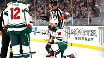 BOSTON, MA - NOVEMBER 23: Minnesota Wild left wing Jason Zucker (16) checks for blood after taking a high stick during a game between the Boston Bruins and the Minnesota Wild on November 23, 2019, at TD Garden in Boston, Massachusetts. (Photo by Fred Kfoury III/Icon Sportswire via Getty Images)