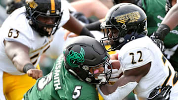 CHARLOTTE, NC - OCTOBER 27: Defensive end Alex Highsmith #5 of the Charlotte 49ers tackles running back Trivenskey Mosley #22 of the Southern Miss Golden Eagles during the football game at Jerry Richardson Stadium on October 27, 2018 in Charlotte, North Carolina. (Photo by Mike Comer/Getty Images)