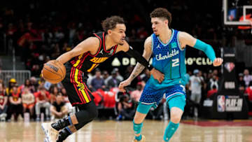 Apr 13, 2022; Atlanta, Georgia, USA; Atlanta Hawks guard Trae Young (11) dribbles defended by Charlotte Hornets guard LaMelo Ball (2) during the second half at State Farm Arena. Mandatory Credit: Dale Zanine-USA TODAY Sports