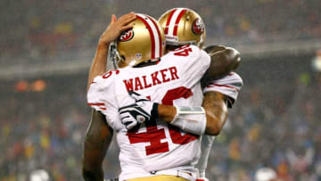 FOXBORO, MA - DECEMBER 16: Tight end Delanie Walker #46 of the San Francisco 49ers celebrates a touchdown pass from quarterback Colin Kaepernick #7 in the second quarter against the New England Patriots at Gillette Stadium on December 16, 2012 in Foxboro, Massachusetts. (Photo by Jared Wickerham/Getty Images)