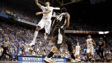 Nov 30, 2014; Lexington, KY, USA; Kentucky Wildcats forward Willie Cauley-Stein (15) lays the ball up against Providence Friars guard Kyron Cartwright (24) during the second half at Rupp Arena. Kentucky defeated Providence 58-38. Mandatory Credit: Mark Zerof-USA TODAY Sports