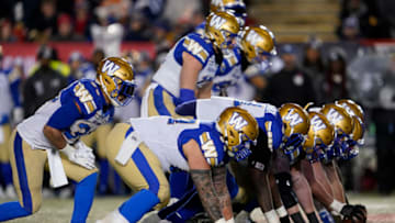 CALGARY, AB - NOVEMBER 24: The Winnipeg Blue Bombers offensive line sets up against the Hamilton Tiger-Cats at McMahon Stadium on November 24, 2019 in Calgary, Canada. Winnipeg Blue Bombers defeated the Hamilton Tiger-Cats 33-12 in the 107th Grey Cup. (Photo by John E. Sokolowski/Getty Images)