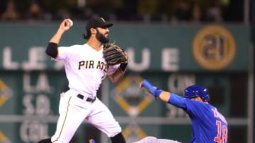 Sep 28, 2016; Pittsburgh, PA, USA; Pittsburgh Pirates shortstop baseman Sean Rodriguez (3) turns a double play over Chicago Cubs second baseman Ben Zobrist (18) during the fourth inning at PNC Park. Mandatory Credit: Charles LeClaire-USA TODAY Sports