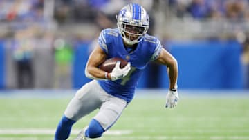 DETROIT, MICHIGAN - NOVEMBER 25: Amon-Ra St. Brown #14 of the Detroit Lions runs up the field after catching a pass in the third quarter against the Chicago Bears at Ford Field on November 25, 2021 in Detroit, Michigan. (Photo by Mike Mulholland/Getty Images)