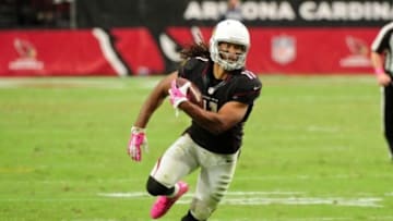 Oct 4, 2015; Glendale, AZ, USA; Arizona Cardinals wide receiver Larry Fitzgerald (11) carries the ball after a catch during the second half against the St. Louis Rams at University of Phoenix Stadium. Mandatory Credit: Matt Kartozian-USA TODAY Sports