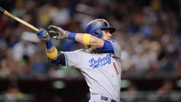 Sep 17, 2016; Phoenix, AZ, USA; Los Angeles Dodgers right fielder Josh Reddick (11) hits a double during the eighth inning against the Arizona Diamondbacks at Chase Field. Mandatory Credit: Joe Camporeale-USA TODAY Sports