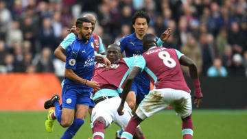 STRATFORD, ENGLAND - MARCH 18: Pedro Obiang of West Ham United (C) attempts to tackle Riyad Mahrez of Leicester City (L) during the Premier League match between West Ham United and Leicester City at London Stadium on March 18, 2017 in Stratford, England. (Photo by Michael Regan/Getty Images)