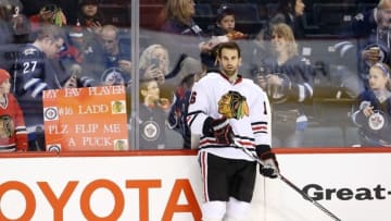 Apr 1, 2016; Winnipeg, Manitoba, CAN; Chicago Blackhawks fans try to get the attention of Blackhawks left wing Andrew Ladd (16) before to a game against the Winnipeg Jets at MTS Centre. Mandatory Credit: Bruce Fedyck-USA TODAY Sports