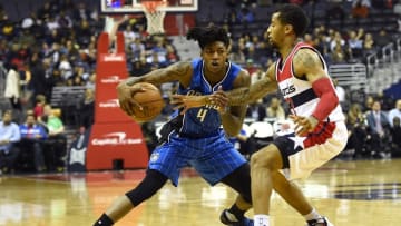 Dec 6, 2016; Washington, DC, USA; Orlando Magic guard Elfrid Payton (4) dribbles as Washington Wizards guard Trey Burke (33) defends during the second quarter at Verizon Center. Mandatory Credit: Tommy Gilligan-USA TODAY Sports