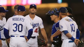 LOS ANGELES, CA - AUGUST 20: Manager Dave Roberts #30 takes JT Chargois #47 out of the game as Justin Turner #10 and Austin Barnes #15 of the Los Angeles Dodgers look on during the fifth inning of a game against the St. Louis Cardinals at Dodger Stadium on August 20, 2018 in Los Angeles, California. (Photo by Sean M. Haffey/Getty Images)
