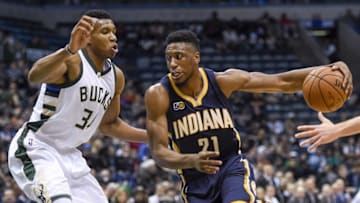 Nov 3, 2016; Milwaukee, WI, USA; Indiana Pacers forward Thaddeus Young (21) dribbles the ball around Milwaukee Bucks forward Giannis Antetokounmpo (34) in the first quarter at BMO Harris Bradley Center. Mandatory Credit: Benny Sieu-USA TODAY Sports