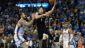 Oct 28, 2016; Oklahoma City, OK, USA; Phoenix Suns guard Devin Booker (1) drives to the basket in font of Oklahoma City Thunder center Steven Adams (12) during the fourth quarter at Chesapeake Energy Arena. Mandatory Credit: Mark D. Smith-USA TODAY Sports