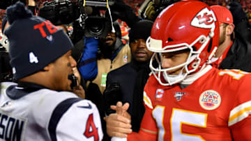 KANSAS CITY, MISSOURI - JANUARY 12: Quarterbacks Patrick Mahomes #15 of the Kansas City Chiefs and Deshaun Watson #4 of the Houston Texans shake hands after Chiefs win the AFC Divisional playoff game 51-31 at Arrowhead Stadium on January 12, 2020 in Kansas City, Missouri. (Photo by Peter Aiken/Getty Images)
