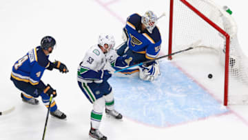EDMONTON, ALBERTA - AUGUST 14: Bo Horvat #53 of the Vancouver Canucks scores the game winner at 5:55 of overtime against Jordan Binnington #50 of the St. Louis Blues in Game Two of the Western Conference First Round during the 2020 NHL Stanley Cup Playoffs at Rogers Place on August 14, 2020 in Edmonton, Alberta, Canada. The Canucks defeated the Blues 4-3 in overtime. (Photo by Jeff Vinnick/Getty Images)