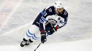 LAS VEGAS, NV - MAY 16, 2018: Dustin Byfuglien #33 of the Winnipeg Jets skates with the puck against the Vegas Golden Knights in the first period of Game Three of the Western Conference Finals during the 2018 NHL Stanley Cup Playoffs at T-Mobile Arena on May 16, 2018 in Las Vegas, Nevada. (Photo by Isaac Brekken/Getty Images)