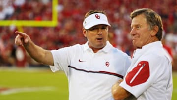 NORMAN, OK - SEPTEMBER 17: Head coach Bob Stoops of the Oklahoma Sooners (L) waits on the field with Steve Spurrier prior to the start of their game against the Ohio State Buckeyes at Gaylord Family Oklahoma Memorial Stadium on September 17, 2016 in Norman, Oklahoma. (Photo by Scott Halleran/Getty Images)