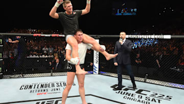 LIVERPOOL, ENGLAND - MAY 27: (R-L) Darren Till of England puts Stephen Thompson on his shoulders in their welterweight bout during the UFC Fight Night event at ECHO Arena on May 27, 2018 in Liverpool, England. (Photo by Josh Hedges/Zuffa LLC/Zuffa LLC via Getty Images)