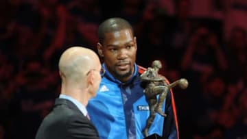May 7, 2014; Oklahoma City, OK, USA; NBA Commissioner Adam Silver presents the NBA Most Valuable Player award to Oklahoma City Thunder forward Kevin Durant (35) prior to action against the Los Angeles Clippers in game two of the second round of the 2014 NBA Playoffs at Chesapeake Energy Arena. Mandatory Credit: Mark D. Smith-USA TODAY Sports