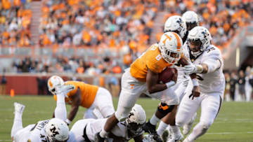 KNOXVILLE, TN - NOVEMBER 17: Ty Chandler #8 of the Tennessee Volunteers runs for yards and avoids a tackle from Joe Hoy #53 of the Missouri Tigers during the first half of the game between the Missouri Tigers and the Tennessee Volunteers at Neyland Stadium on November 17, 2018 in Knoxville, Tennessee. (Photo by Donald Page/Getty Images)