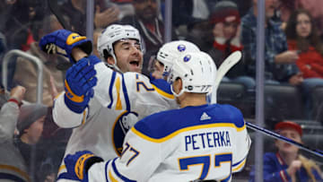 Nov 30, 2022; Detroit, Michigan, USA; Buffalo Sabres defenseman Mattias Samuelsson (23) receives congratulations from teammates after scoring in the first period against the Detroit Red Wings at Little Caesars Arena. Mandatory Credit: Rick Osentoski-USA TODAY Sports