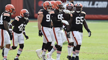 Sep 27, 2020; Cleveland, Ohio, USA; Cleveland Browns defensive end Myles Garrett (95) and the Browns defense leave the field after Garrett recovered a fumble during the second half against the Washington Football Team at FirstEnergy Stadium. Mandatory Credit: Ken Blaze-USA TODAY Sports