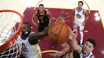 CLEVELAND, OH - JUNE 08: Larry Nance Jr. #22 of the Cleveland Cavaliers competes for the ball with Draymond Green #23 and Klay Thompson #11 of the Golden State Warriors in the first half during Game Four of the 2018 NBA Finals at Quicken Loans Arena on June 8, 2018 in Cleveland, Ohio. NOTE TO USER: User expressly acknowledges and agrees that, by downloading and or using this photograph, User is consenting to the terms and conditions of the Getty Images License Agreement. (Photo by Kyle Terada - Pool/Getty Images)