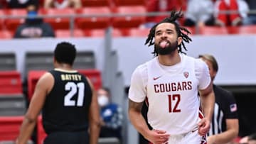 Jan 30, 2022; Pullman, Washington, USA; Washington State Cougars guard Michael Flowers (12) celebrates a three pointer against the Colorado Buffaloes in the first half at Friel Court at Beasley Coliseum. Mandatory Credit: James Snook-USA TODAY Sports