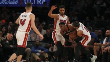 RJ Barrett #9 of the New York Knicks tries to keep the ball as he is surrounded during the first quarter by Omer Yurtseven #77, Gabe Vincent #2 and Tyler Herro #14 of the Miami Heat(Photo by Jim McIsaac/Getty Images)
