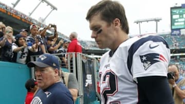 Jan 3, 2016; Miami Gardens, FL, USA; New England Patriots quarterback Tom Brady (12) leaves the field at the end of the game after losing to the Miami Dolphins 20-10 at Sun Life Stadium. Mandatory Credit: Andrew Innerarity-USA TODAY Sports