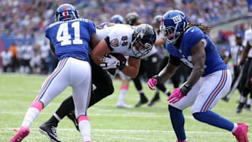 Oct 16, 2016; East Rutherford, NJ, USA; Baltimore Ravens tight end Dennis Pitta (88) runs the ball against New York Giants corner back Dominique Rodgers-Cromartie (41) and linebacker Kelvin Sheppard (91) during the first quarter at MetLife Stadium. Mandatory Credit: Brad Penner-USA TODAY Sports