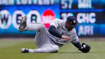 Apr 8, 2016; Detroit, MI, USA; New York Yankees center fielder Aaron Hicks (31) makes a catch of a ball hit by Detroit Tigers right fielder J.D. Martinez (not pictured) for an out in the seventh inning at Comerica Park. Mandatory Credit: Rick Osentoski-USA TODAY Sports