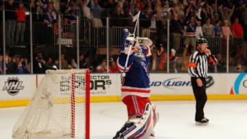 NEW YORK, NY - MAY 12: Goalie Henrik Lundqvist #30 of the New York Rangers celebrates after they won 2-1 against the Washington Capitals in Game Seven of the Eastern Conference Semifinals during the 2012 NHL Stanley Cup Playoffs at Madison Square Garden on May 12, 2012 in New York City. (Photo by Paul Bereswill/Getty Images)