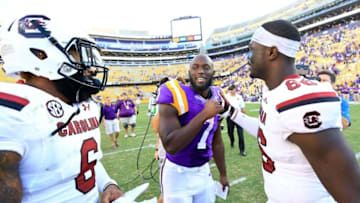 Oct 10, 2015; Baton Rouge, LA, USA; LSU Tigers running back Leonard Fournette (7) talks to South Carolina Gamecocks tight end Kevin Crosby (86) and safety Chris Moody (6) following road game at Tiger Stadium. LSU defeated South Carolina 45-24. Mandatory Credit: Derick E. Hingle-USA TODAY Sports