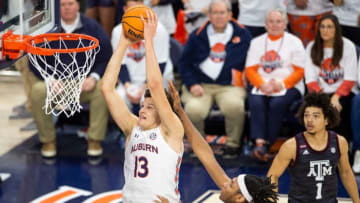 Auburn basketball player Walker Kessler (13) dunks the ball as Auburn Tigers men's basketball takes on Texas A&M Aggies at Auburn Arena in Auburn, Ala., on Saturday, Feb. 12, 2022. Auburn Tigers defeated Texas A&M Aggies 75-58.