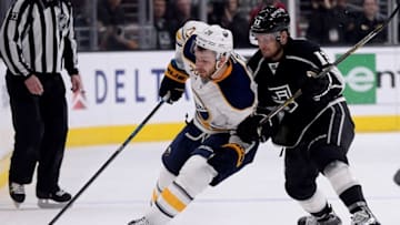 Feb 27, 2016; Los Angeles, CA, USA; Los Angeles Kings left wing Kyle Clifford (13) battles with Buffalo Sabres center Zemgus Girgensons (28) for the puck in the first period of the game at Staples Center. Mandatory Credit: Jayne Kamin-Oncea-USA TODAY Sports