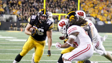 IOWA CITY, IOWA- SEPTEMBER 22: Fullback Brady Ross #36 of the Iowa Hawkeyes runs up the field during the second half against safety D'Cota Dixon #14 of the Wisconsin Badgers on September 22, 2018 at Kinnick Stadium, in Iowa City, Iowa. (Photo by Matthew Holst/Getty Images)