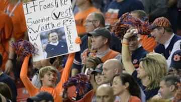 Dec 7, 2013; Atlanta, GA, USA; An Auburn Tigers fan holds up a sign referencing Auburn Tigers head coach Gus Malzahn during the fourth quarter of the 2013 SEC Championship game against the Missouri Tigers at Georgia Dome. Auburn won 59-42. Mandatory Credit: John David Mercer-USA TODAY Sports