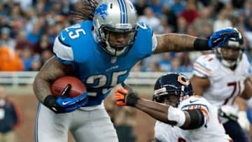 Dec 30, 2012; Detroit, MI, USA; Detroit Lions running back Mikel Leshoure (25) gets past Chicago Bears cornerback Charles Tillman (33) during the second quarter at Ford Field. Mandatory Credit: Tim Fuller-USA TODAY Sports
