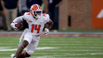 Jan 30, 2021; Mobile, AL, USA; American wide receiver Cornell Powell of Clemson (14) gets loose in the second half of the 2021 Senior Bowl at Hancock Whitney Stadium. Mandatory Credit: Vasha Hunt-USA TODAY Sports
