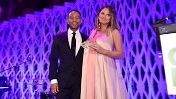 NEW YORK, NY - APRIL 24: John Legend (L) and Chrissy Teigen speak onstage during City Harvest's 35th Anniversary Gala at Cipriani 42nd Street on April 24, 2018 in New York City. (Photo by Bryan Bedder/Getty Images for City Harvest)