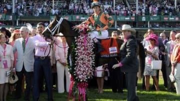 May 1, 2015; Lexington, KY, USA; Kerwin Clark aboard Lovely Maria celebrates after winning the 141st Kentucky Oaks at Churchill Downs. Mandatory Credit: Jamie Rhodes-USA TODAY Sports