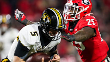 ATHENS, GA - NOVEMBER 09: Taylor Powell #5 of the Missouri Tigers is defended by Quay Walker #25 of the Georgia Bulldogs during the second half of a game at Sanford Stadium on November 9, 2019 in Athens, Georgia. (Photo by Carmen Mandato/Getty Images)