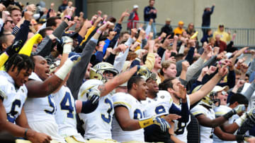 ATLANTA, GA - NOVEMBER 11: Members of the Georgia Tech Yellow Jackets celebrate with fans after the game against the Virginia Tech Hokies on November 11, 2017 at Bobby Dodd Stadium in Atlanta, Georgia. (Photo by Scott Cunningham/Getty Images)