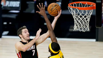 LAKE BUENA VISTA, FLORIDA - AUGUST 20: Goran Dragic #7 of the Miami Heat shoots over Justin Holiday #8 of the Indiana Pacers in the first half in Game Two during the first round of the NBA playoffs at The Field House at ESPN Wide World Of Sports Complex on August 20, 2020 in Lake Buena Vista, Florida. NOTE TO USER: User expressly acknowledges and agrees that, by downloading and or using this photograph, User is consenting to the terms and conditions of the Getty Images License Agreement. (Photo by Ashley Landis-Pool/Getty Images)
