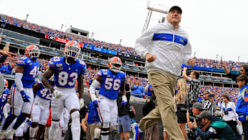JACKSONVILLE, FLORIDA - NOVEMBER 02: Head coach Dan Mullen leads the Florida Gators onto the field during a game against the Georgia Bulldogs on November 02, 2019 in Jacksonville, Florida. (Photo by Mike Ehrmann/Getty Images)