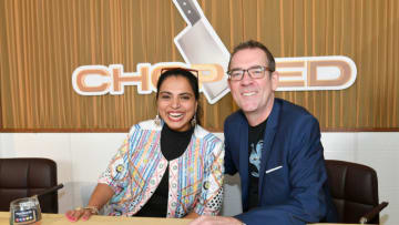 NEW YORK, NEW YORK - OCTOBER 13: Chopped's Maneet Chauhan (L) and Ted Allen pose during Sunday Brunch hosted by Marc Murphy and Devour Power at Pier 97 on October 13, 2019 in New York City. (Photo by Dia Dipasupil/Getty Images for NYCWFF)