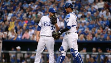 Kansas City Royals catcher Salvador Perez (13) talks to starting pitcher Ian Kennedy (31) - Mandatory Credit: John Rieger-USA TODAY Sports